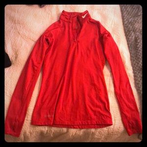 Nike Therma Fit dark pink workout top.